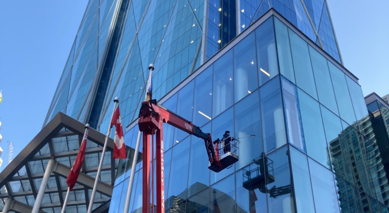 Specialized Equipment Window cleaning crew working on the glass facade of CIBC Square Toronto