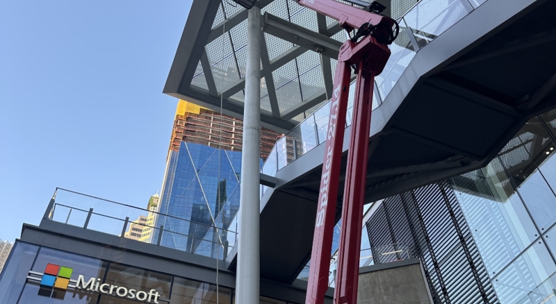 Spider lift being used for window cleaning with the Microsoft building standing tall in the Toronto skyline